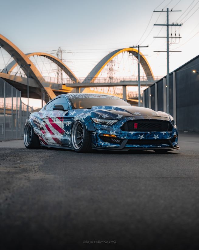 Widebody Mustang with custom American flag style printed wrap