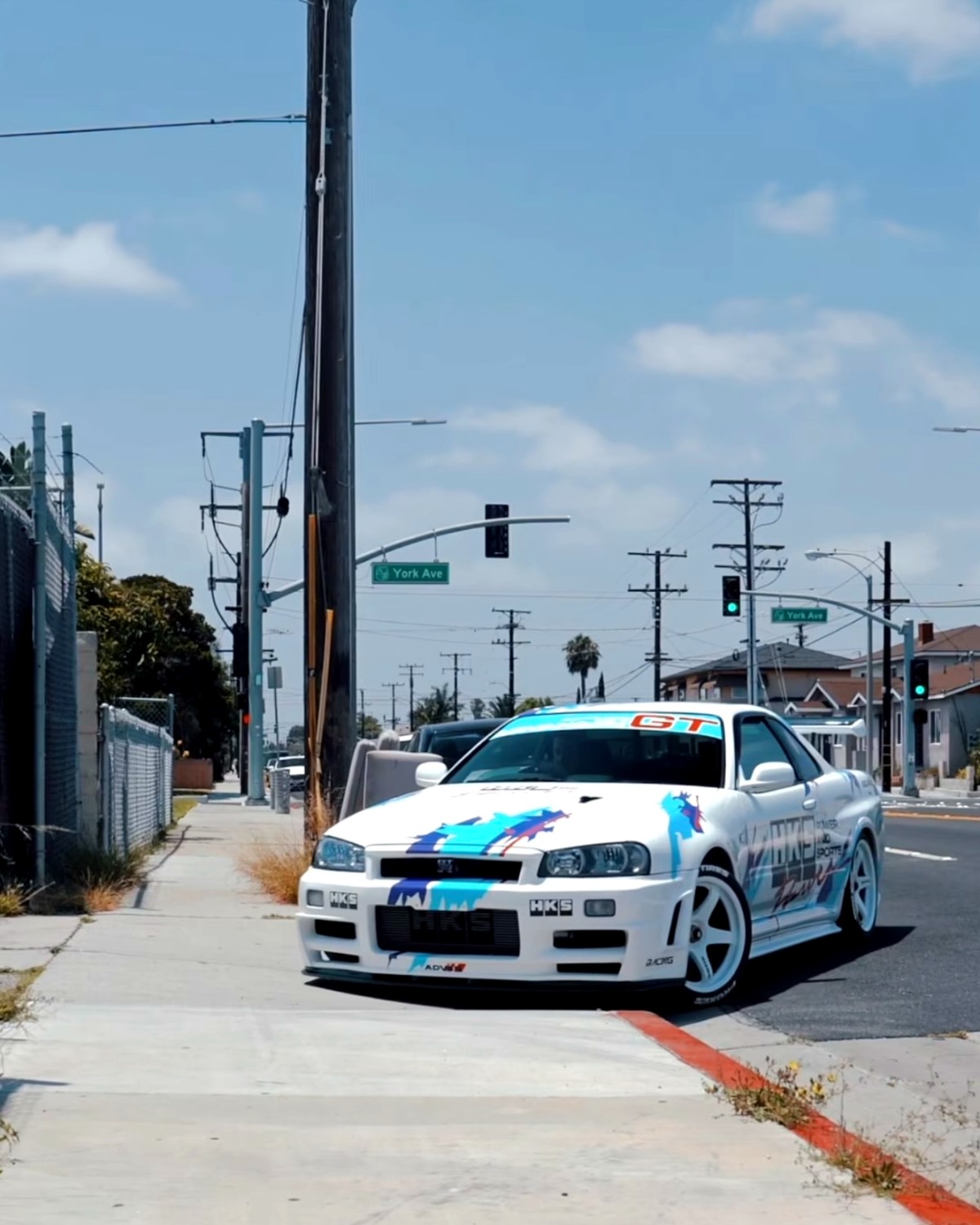 Nissan Skyline R34 with custom motorsports graphics by IMPCBL Motorsports